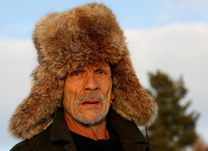 Baburin wearing Siberian lynx fur hat is seen in remote Siberian village of Mikhailovka